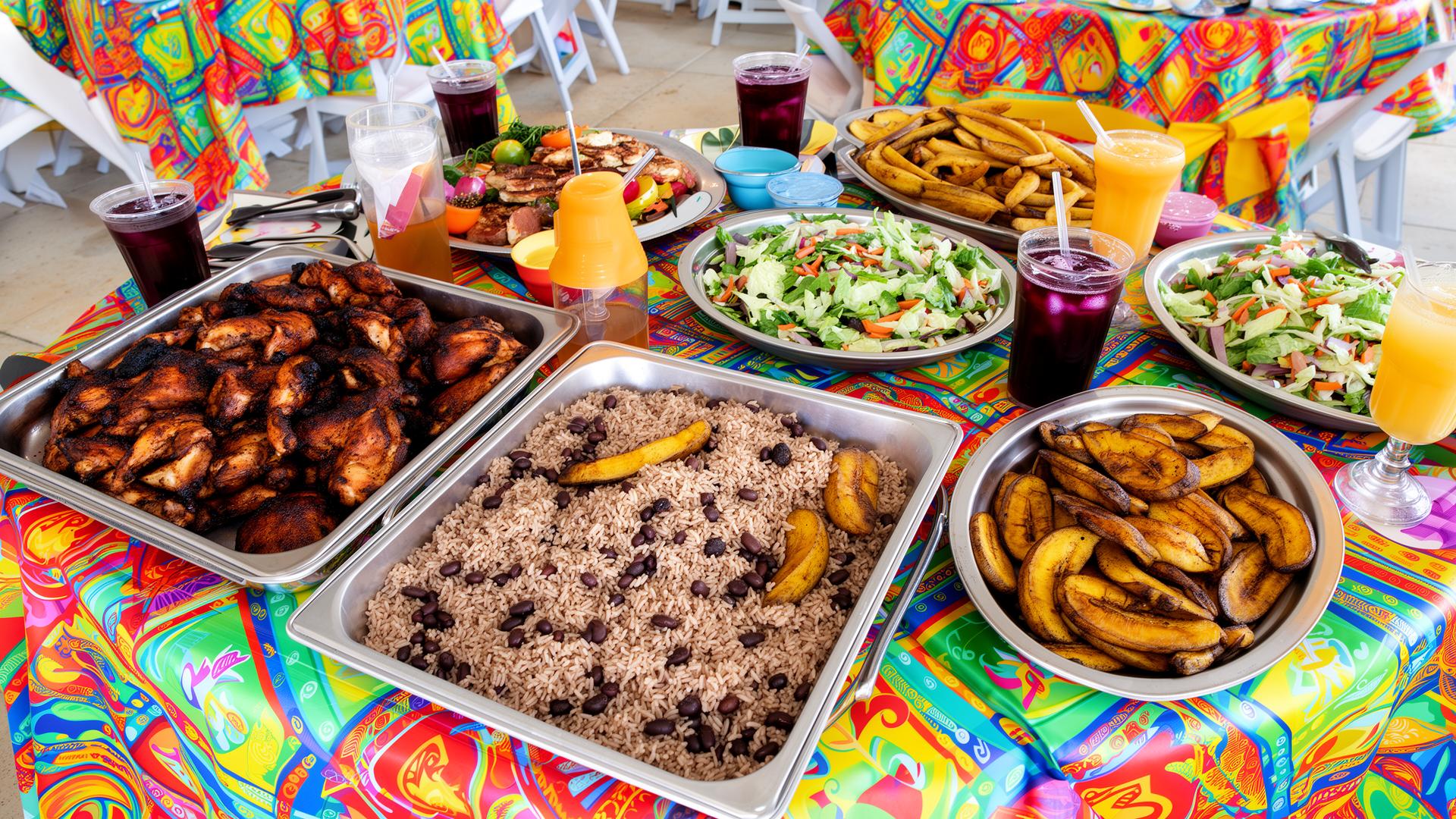 Caribbean catering buffet spread with jerk chicken, rice and plantains